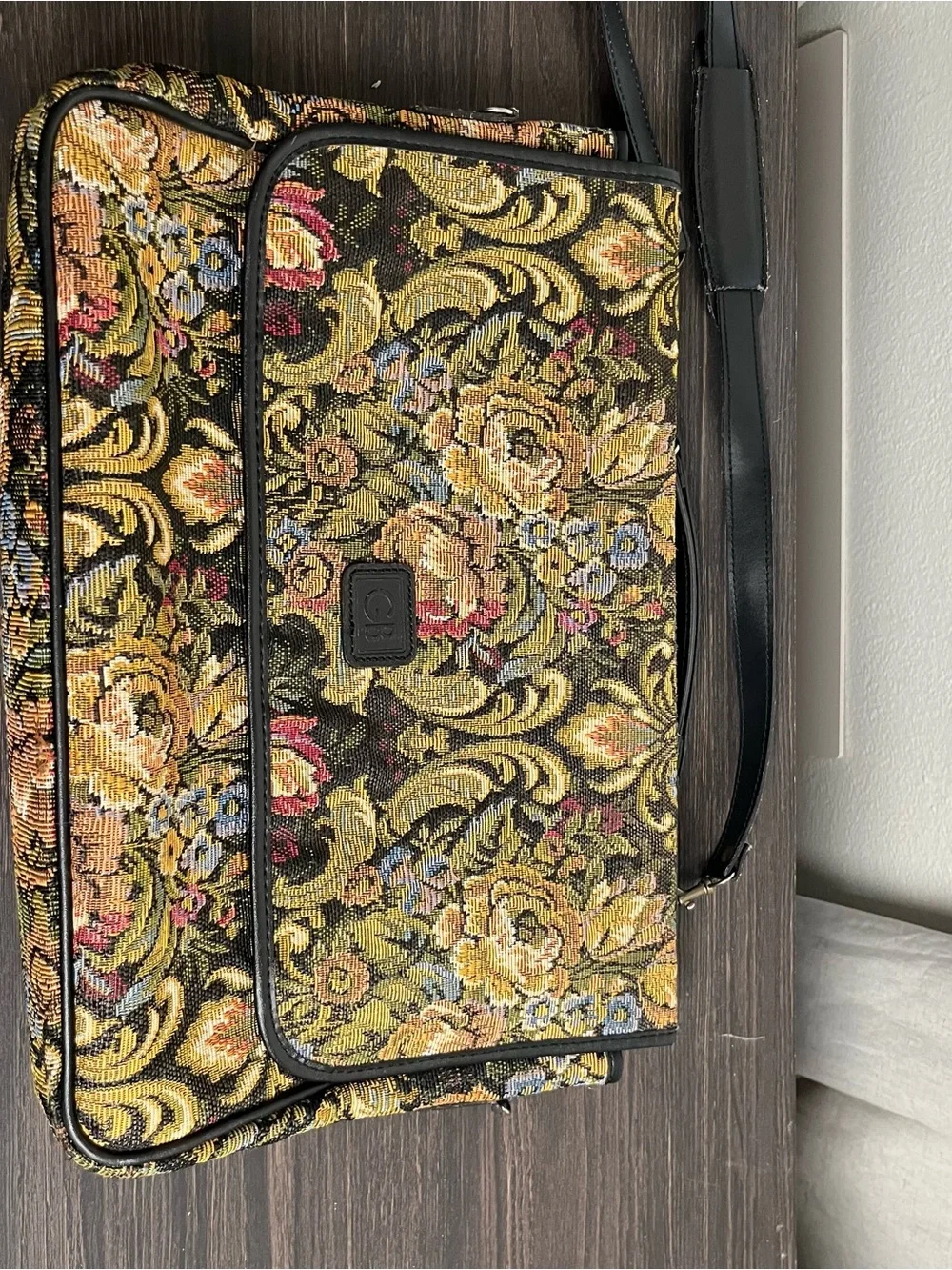 Geoffrey Beene messenger bag ft vibrant floral tapestry ext & black leather trim